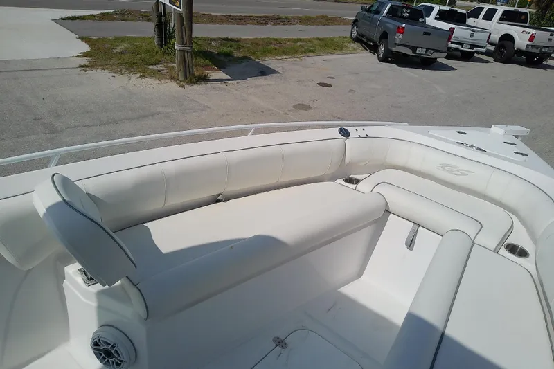 Slide: The Image of 2022 Glasstream 280 Pro-XS boat interior with white seating and speaker. - 22
