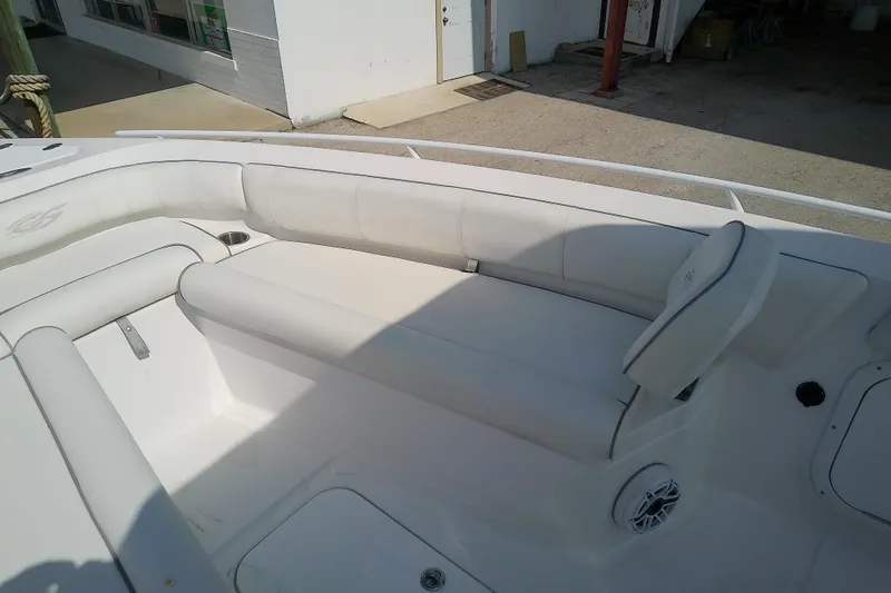Slide: The Image of 2022 Glasstream 280 Pro-XS boat interior with white cushioned seating. - 23