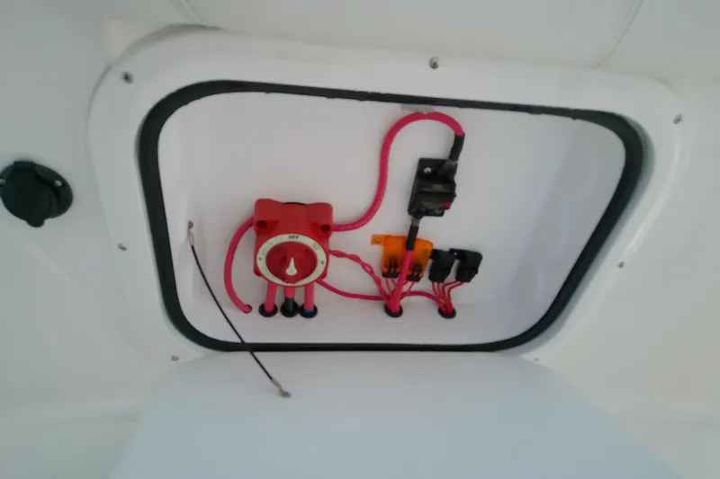 Slide: The Image of Electrical panel inside 2022 Glasstream 280 Pro-XS boat, featuring wiring and switches. - 29