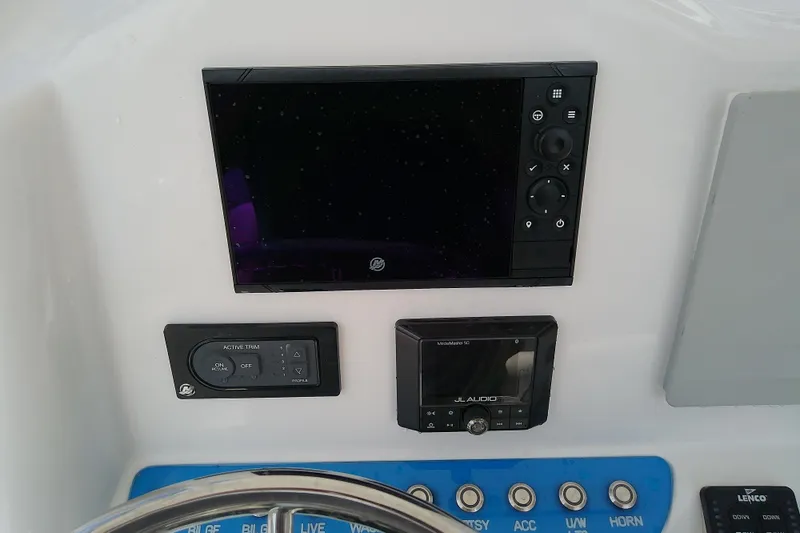 Slide: The Image of Control panel of 2022 Glasstream 280 Pro-XS boat with navigation and audio systems. - 31