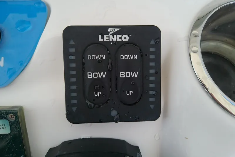 Slide: The Image of Lenco trim tab control panel on 2022 Glasstream 280 Pro-XS boat. - 35