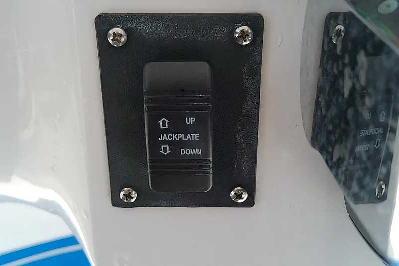 Slide: The Image of Jackplate control switch on 2022 Glasstream 280 Pro-XS boat dashboard. - 36