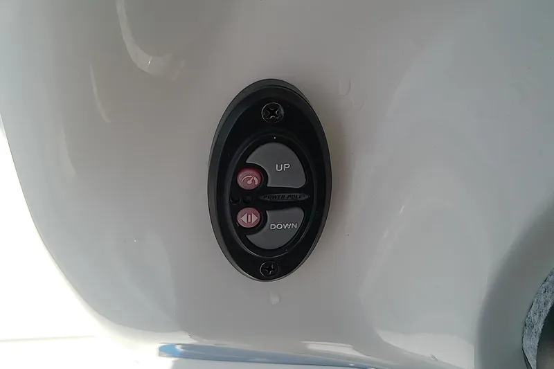 Slide: The Image of Control panel on a 2022 Glasstream 280 Pro-XS boat, featuring up and down buttons. - 37