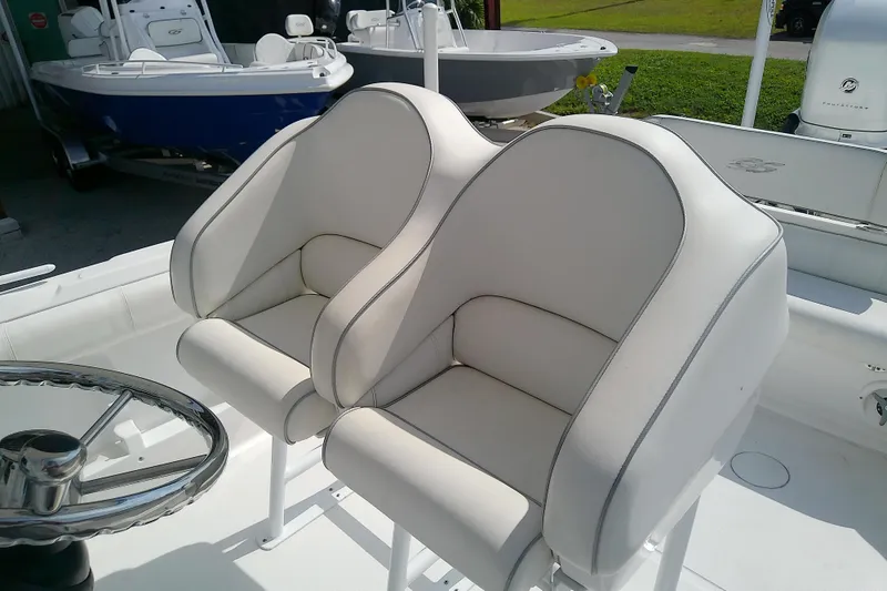 Slide: The Image of 2022 Glasstream 280 Pro-XS boat with plush white seating and steering wheel. - 39