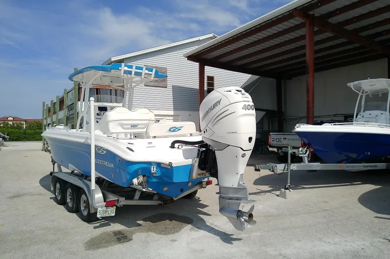 Slide: The Image of 2022 Glasstream 280 Pro-XS boat with Mercury 400 engine on trailer, parked outdoors. - 6