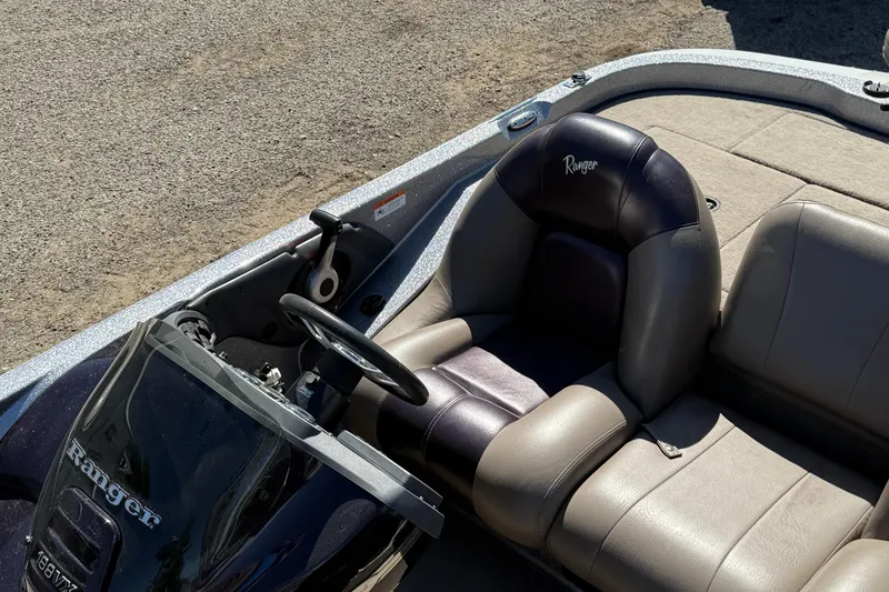 Slide: The Image of 2009 Ranger 188 VX boat interior with steering wheel and seating. - 18