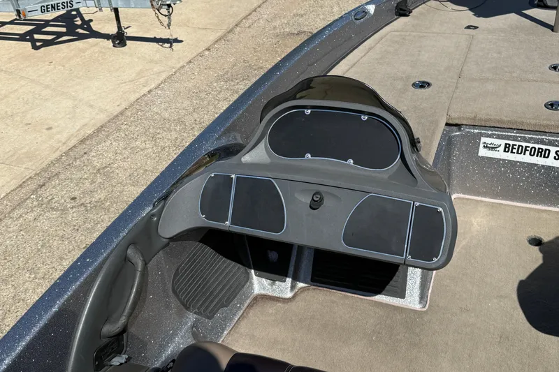 Slide: The Image of 2009 Ranger 188 VX boat dashboard and seating area, featuring a sleek design. - 22