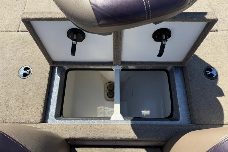 Slide: The Image of 2009 Ranger 188 VX boat storage compartment with open hatch and secure latches. - 27