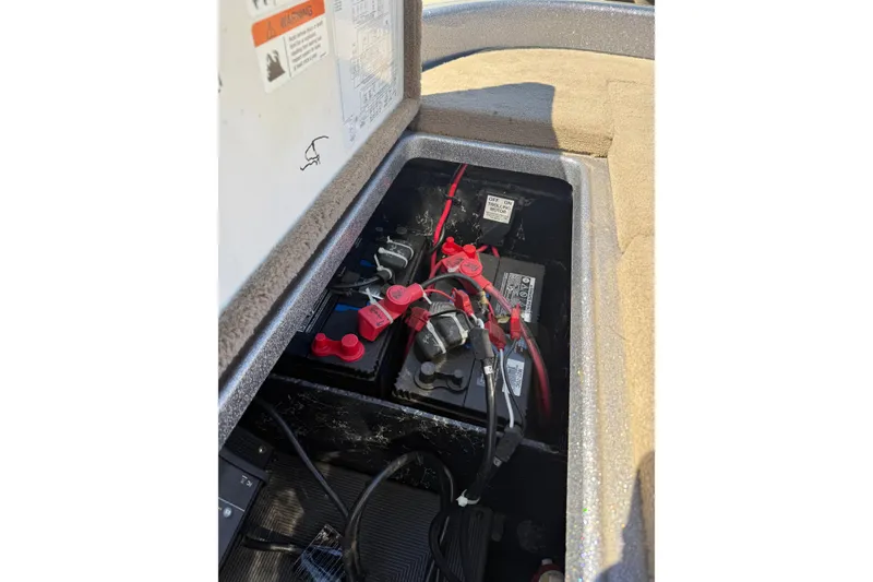 Slide: The Image of Battery compartment of a 2009 Ranger 188 VX boat with wiring and connections. - 29