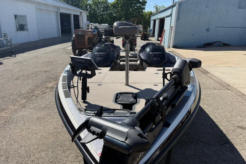 Slide: The Image of 2009 Ranger 188 VX boat with Garmin equipment, parked near garages. - 3