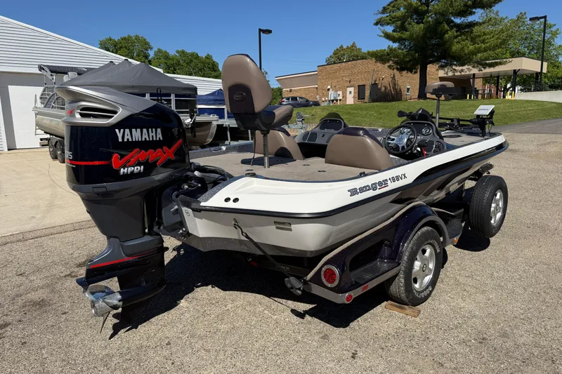 Slide: The Image of 2009 Ranger 188 VX boat with Yamaha VMAX HPDI engine, parked outdoors. - 6