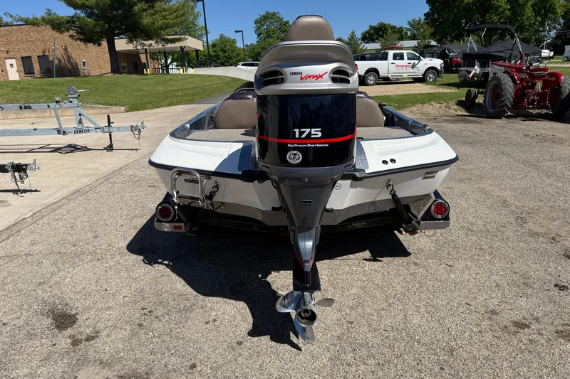 Slide: The Image of 2009 Ranger 188 VX boat with Yamaha 175 engine, parked outdoors. - 7