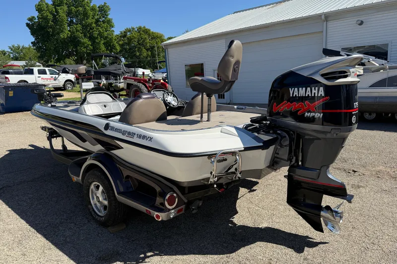 Slide: The Image of 2009 Ranger 188 VX boat with Yamaha VMAX engine, parked outdoors. - 8