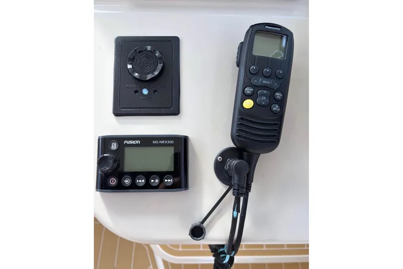 Slide: The Image of Control panel of a 2018 Boston Whaler 315 Conquest with radio and audio system. - 11