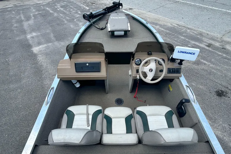 Slide: The Image of 1996 Tracker Tournament V-17 boat interior with steering wheel, seats, and Lowrance equipment. - 11