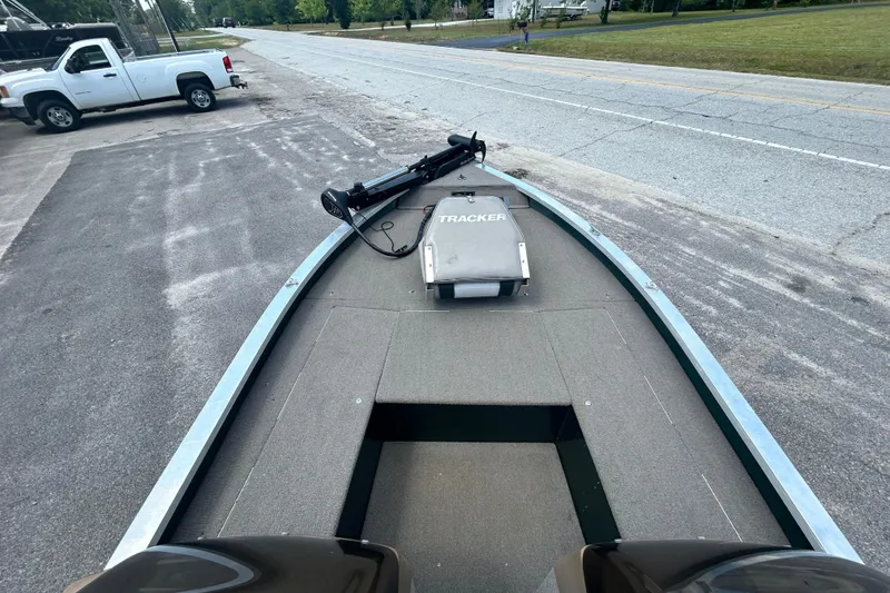 Slide: The Image of 1996 Tracker Tournament V-17 boat on trailer, parked beside a road. - 12