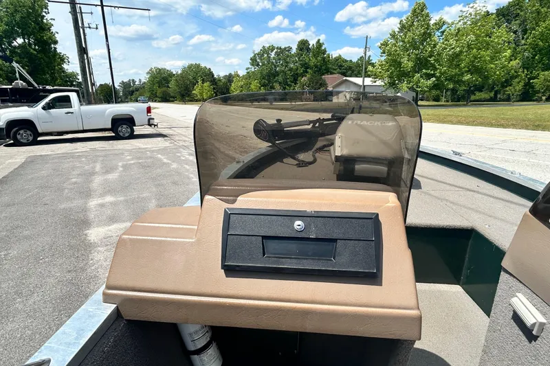 Slide: The Image of 1996 Tracker Tournament V-17 boat dashboard with windshield, parked outdoors. - 9