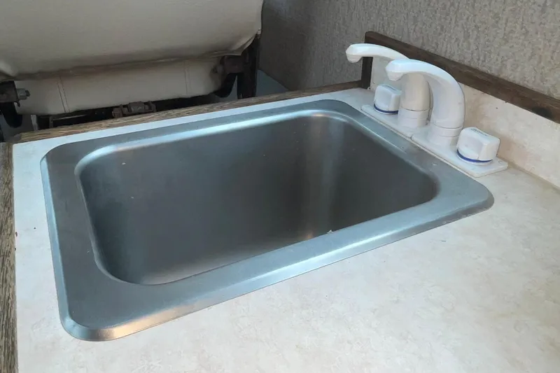 Slide: The Image of Stainless steel sink with white faucet in 2005 Lifetimer 3540 model. - 11
