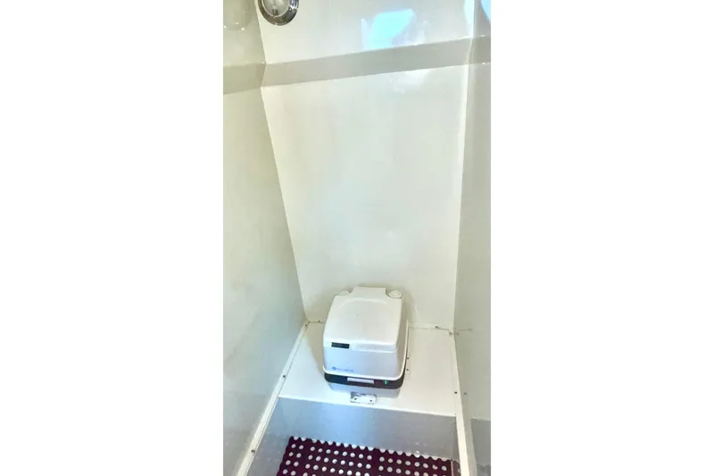Slide: The Image of Compact bathroom with a Lifetimer 3540 toilet, 2005 model, featuring a white interior. - 12