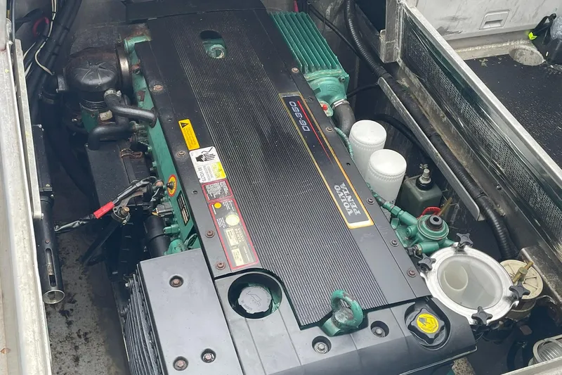 Slide: The Image of Engine compartment of a 2005 Lifetimer 3540 boat, featuring a Volvo Penta engine. - 25