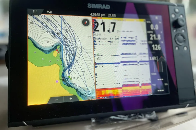 Slide: The Image of Marine navigation display showing charts and sonar data on a Simrad device, Lifetimer 3540, 2005 model. - 6