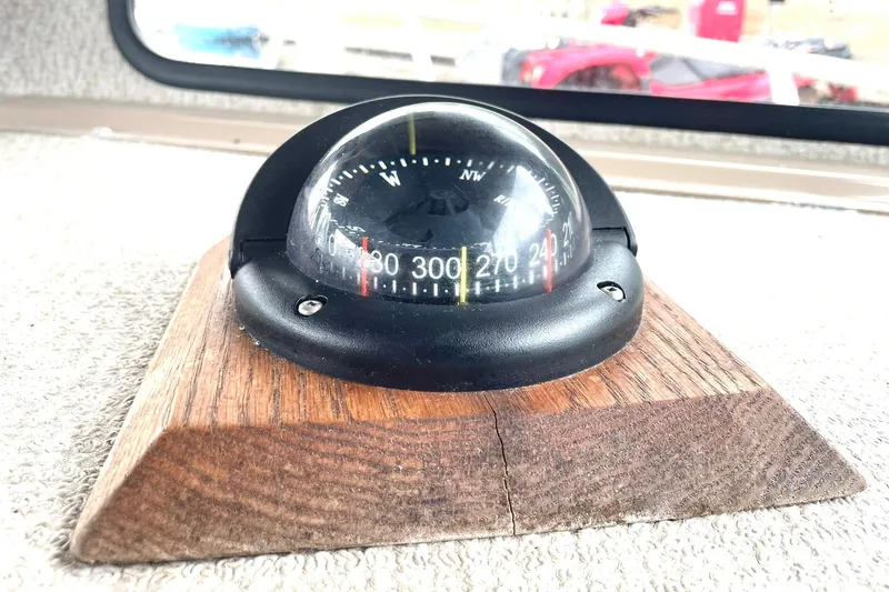 Slide: The Image of Boat compass on wooden mount, Lifetimer 3540, 2005 model, showing cardinal directions. - 7