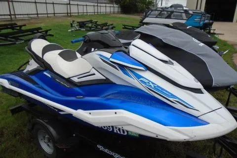 The Image of 2021 Yamaha WaveRunner FX Cruiser HO in blue and white on a trailer. - 0