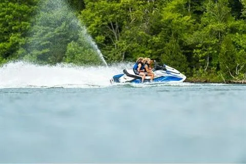 Slide: The Image of 2021 Yamaha WaveRunner FX Cruiser HO speeding on a lake with lush green forest backdrop. - 15