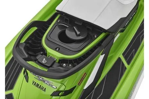 Slide: The Image of 2021 Yamaha WaveRunner FX Cruiser HO in vibrant green, showcasing fuel cap and seat design. - 7