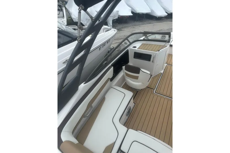 Slide: The Image of 2021 Yamaha Boats 195S interior with sleek seating and modern dashboard design. - 10