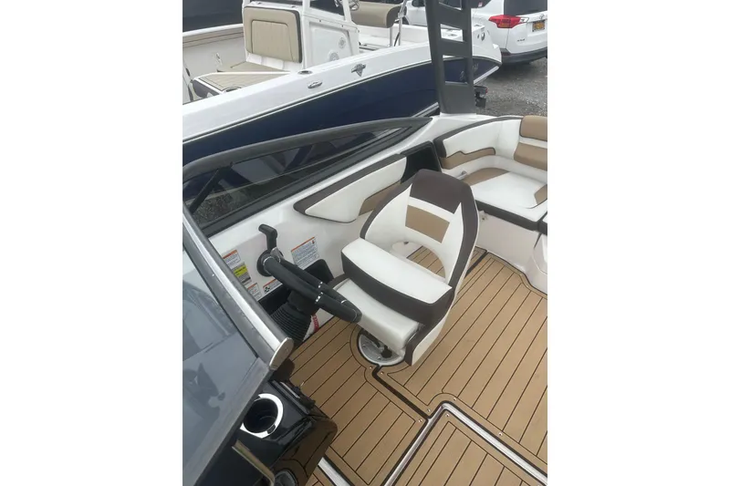 Slide: The Image of 2021 Yamaha Boats 195S interior with sleek seating and modern helm design. - 11