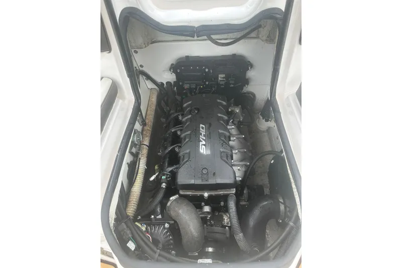 Slide: The Image of Engine compartment of a 2021 Yamaha Boats 195S, showcasing the powerful engine setup. - 15
