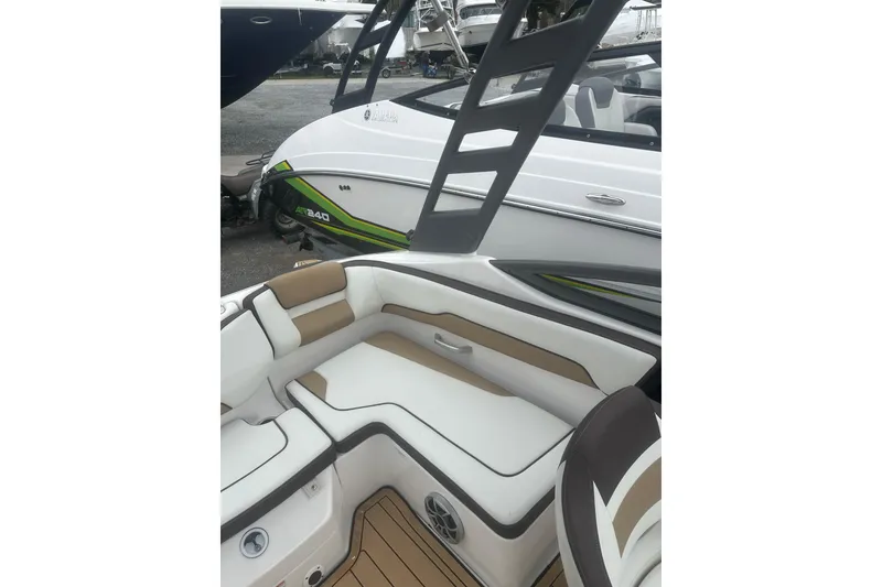 Slide: The Image of 2021 Yamaha Boats 195S interior with cushioned seating and sleek design. - 23