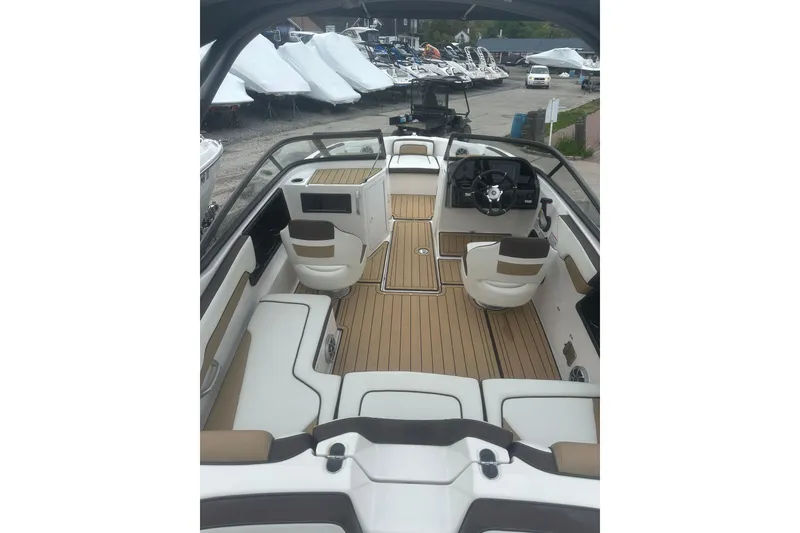 Slide: The Image of 2021 Yamaha Boats 195S interior with sleek seating and modern dashboard design. - 27