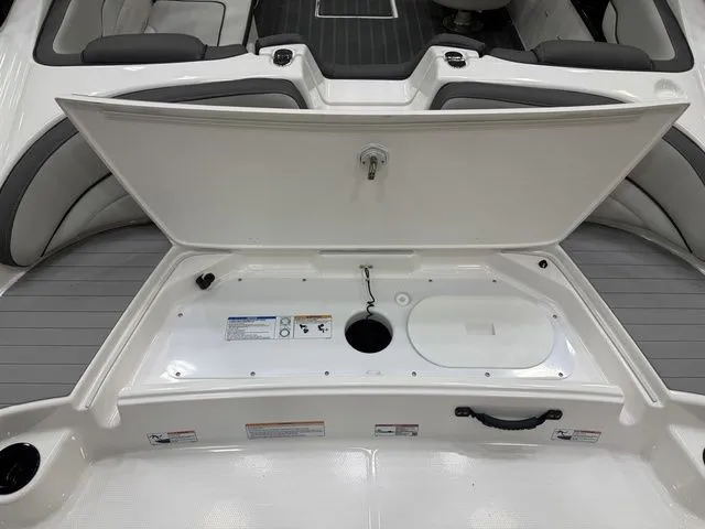 Slide: The Image of Yamaha Boats AR190 2026 storage compartment with open lid. - 4