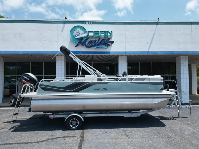 Slide: The Image of 2026 Avalon VNT VRB21 pontoon boat in front of Ocean Marine building. - 18