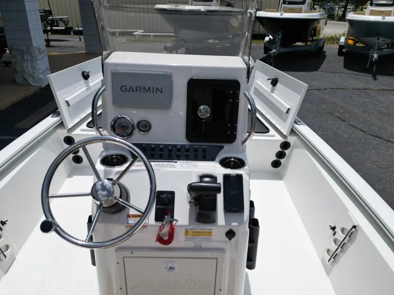 Slide: The Image of Interior view of Avid 19 FSX 2026 boat with Garmin controls. - 20