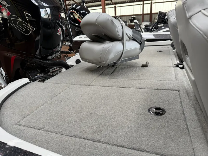 Slide: The Image of Interior of 2024 Nitro Z18 Pro with gray seats and carpeted floor. - 16