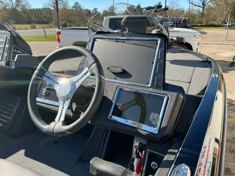 Slide: The Image of Interior view of 2024 Ranger Z520R boat with steering wheel and dashboard. - 15
