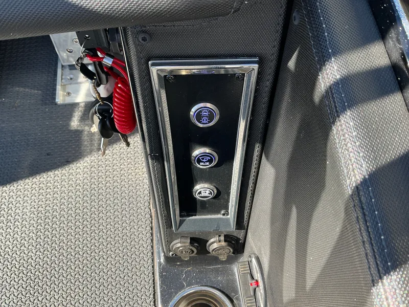 Slide: The Image of 2024 Ranger Z520R boat control panel with switches and sockets. - 20