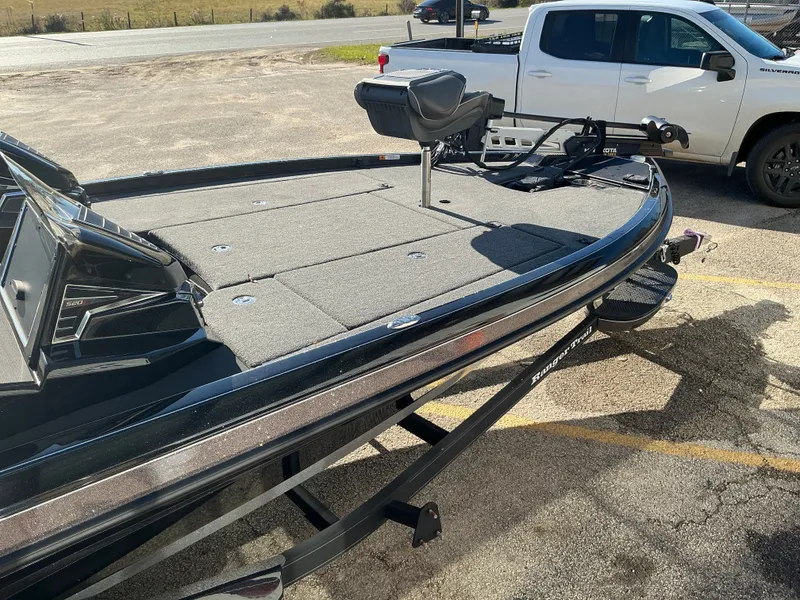Slide: The Image of 2024 Ranger Z520R boat on trailer beside pickup truck. - 21