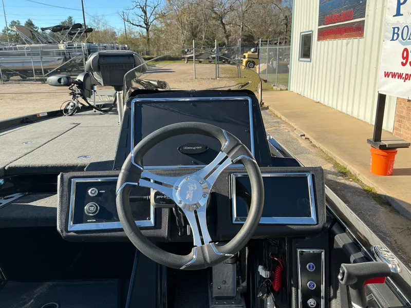 Slide: The Image of Interior view of 2024 Ranger Z520R with steering wheel and controls. - 28