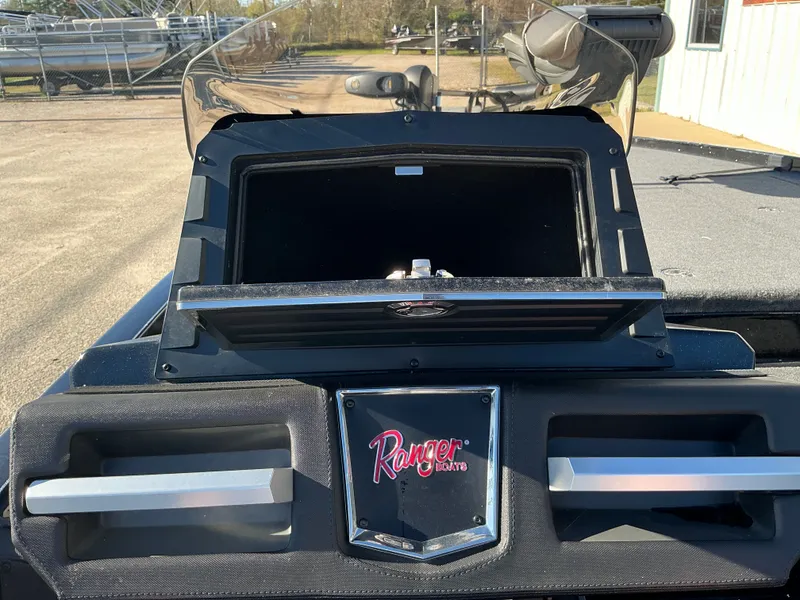 Slide: The Image of 2024 Ranger Z520R boat console with storage compartment and logo. - 30