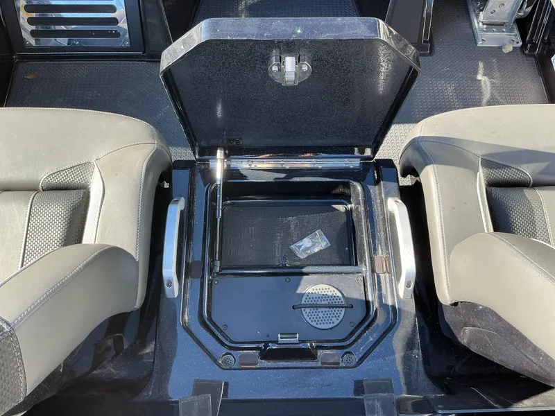 Slide: The Image of Interior of 2024 Ranger Z520R with open storage compartment. - 40