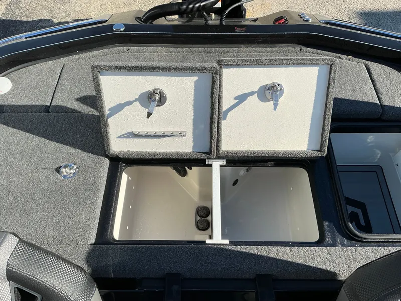 Slide: The Image of 2024 Ranger Z520R boat with storage compartments and seating area. - 44
