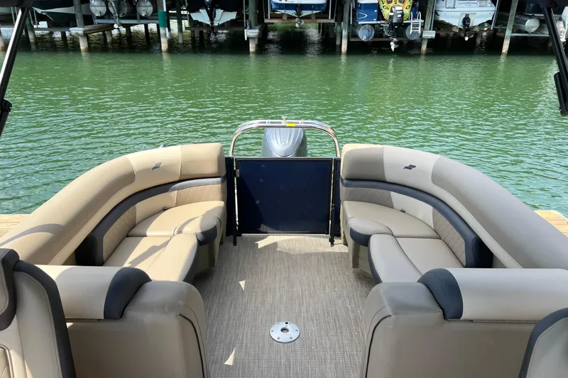 Slide: The Image of Luxurious 2026 Starcraft EXS 3 R DH pontoon boat interior with plush seating. - 11