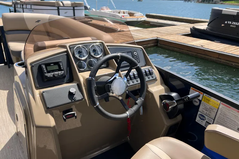 Slide: The Image of Steering console of 2026 Starcraft EXS 3 R DH boat at dockside. - 13