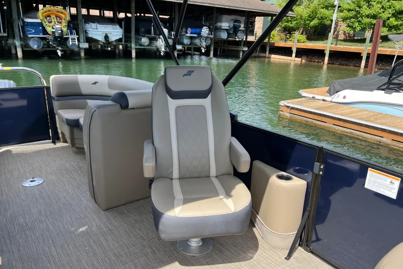 Slide: The Image of Luxury seating on 2026 Starcraft EXS 3 R DH boat at marina. - 9