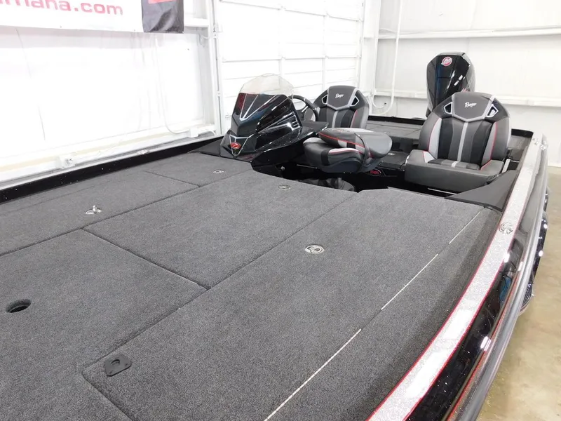 Slide: The Image of 2024 Ranger Z521R boat with gray deck and black seats. - 10
