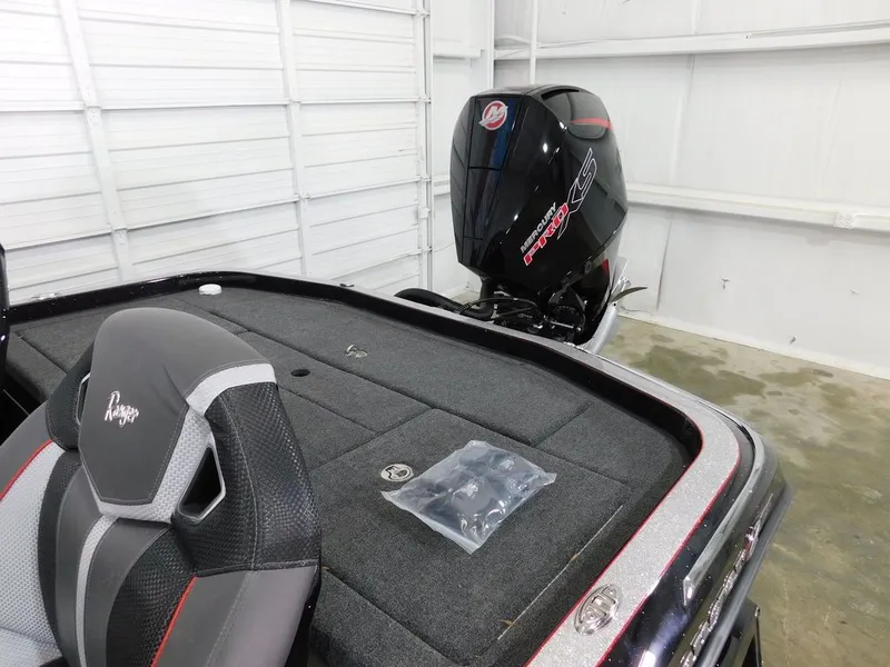 Slide: The Image of 2024 Ranger Z521R boat with Mercury engine in garage. - 13
